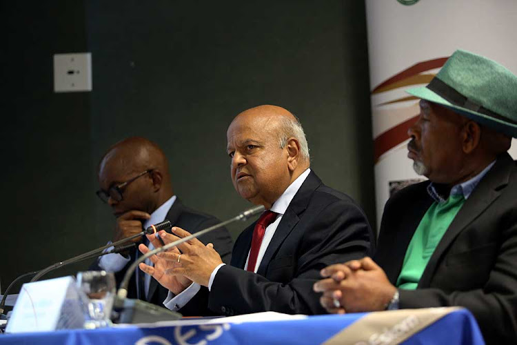 Eskom CEO Phakamani Hadebe, public enterprises minister Pravin Gordhan and Eskom chairman Jabu Mabuza during a media briefing at the Lethabo power station on April 2 2019.