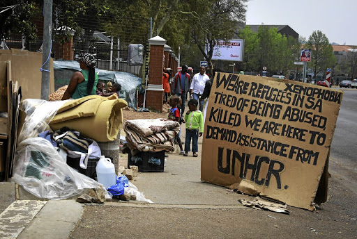 Refugees, asylum seekers and migrants camp outside the UNHCR office in Pretoria. They survive on handouts from strangers.