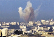 DEADLY STRIKES: Smoke caused by explosions rises in the Gaza Strip yesterday. 05/01/2009. © AP Photo: Pic. Ariel Schalit