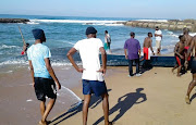 Teaming nets of Sardines had been pulled ashore at Isipingo early in the morning. 
