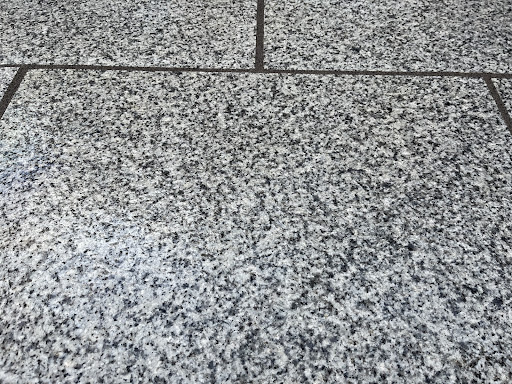 Granite slabs with grey resin grout 