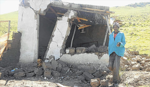 HOMELESS: Unemployed Zingisile Kolanisi,52, stands next to what remains of his three-roomed mud house after it was demolished on orders by municipal bosses on Thursday Picture:SIKHO NTSHOBANE