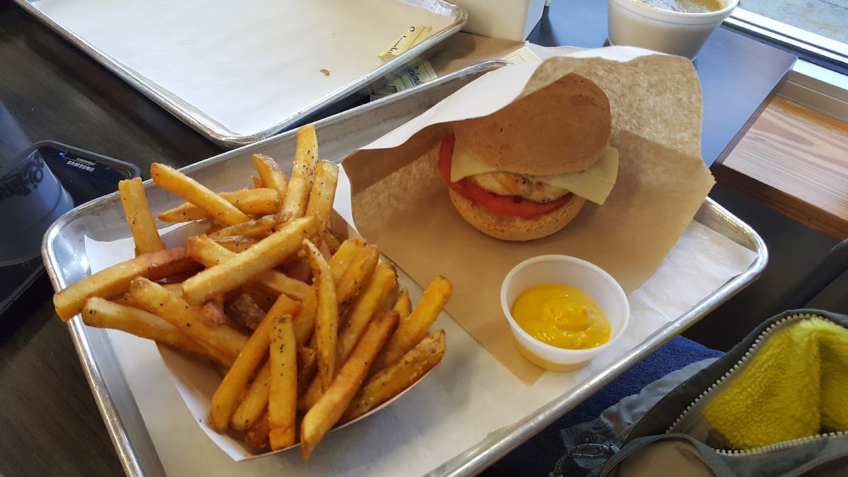 GF grilled chicken burger with fries from a dedicated fryer