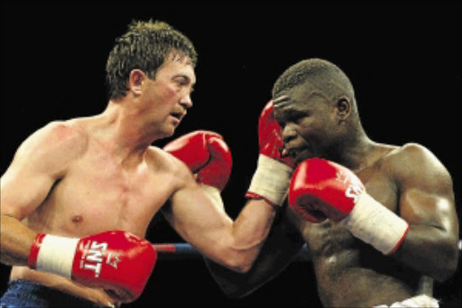 FADING: SA middleweight champion Christopher Buthelezi in his failed attempt to beat Andre Thysse for the super middle- weight title Photo: Tertius Pickard/ Gallo Images