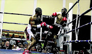 NEW HERO:  Mxolisi Nombewu pins Xolani Radi  against the ropes  during their   fight in 2014. Nombewu faces Sabelo Ngebiyane this week  Photo:  Michael Pinyana