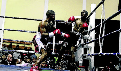 NEW HERO: Mxolisi Nombewu pins Xolani Radi against the ropes during their fight in 2014. Nombewu faces Sabelo Ngebiyane this week Photo: Michael Pinyana