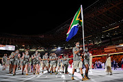 Flag bearers Phumelela Luphumlo Mbande and Chad Le Clos lead Team SA out at the opening ceremony of the Tokyo 2020 Olympic Games on July 23 2021.