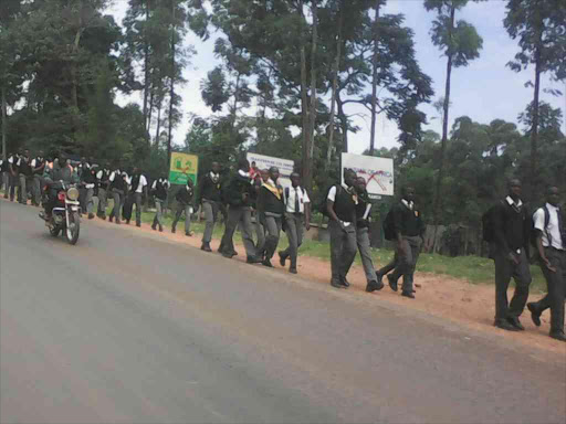 Students of Kisii High School leave following its closure after a dormitory fire that led to the arrests of eight of them, July 11, 2018. /BENSON NYAGESIBA