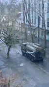 A military truck and tank are seen on a street of Kherson, Ukraine March 1, 2022, in this screen grab from a video obtained by Reuters on March 2, 2022.