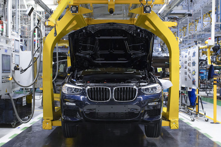 A BMW X3 moves along the production line at the BMW Rosslyn plant in Midrand, South Africa.