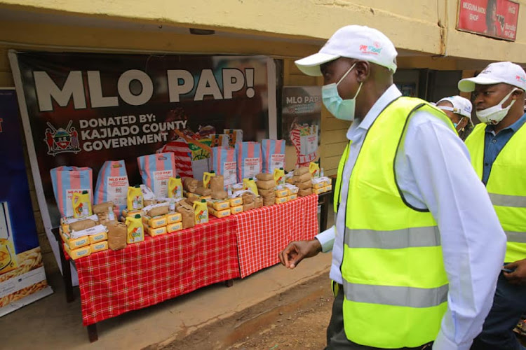 Kajiado Governor Joseph ole Lenku at the new digital relief food distribution programme launched in Ngong town