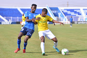 Yasir Mozamil Mohamed of Al Hilal challenges Lyle Lakay of Mamelodi Sundowns during their Caf Champions League match in Omdurman.