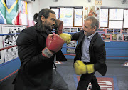 Model agency executive Brett Whitehead, left, and businessman Andrew Sturrock spar ahead of last night's first major white-collar boxing event in Cape Town Picture: ESA ALEXANDER