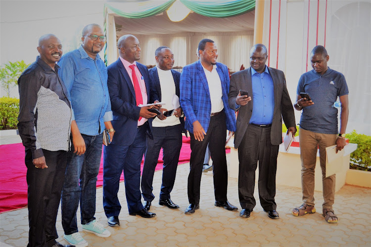 A section of aspirants seeking the Kitui Assembly speaker's seat pose for a picture after attending a meeting with the Assembly clerk.