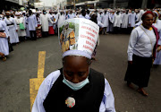 Members of the Nazareth Baptist church took to the streets on Tuesday clad in white to march peacefully.