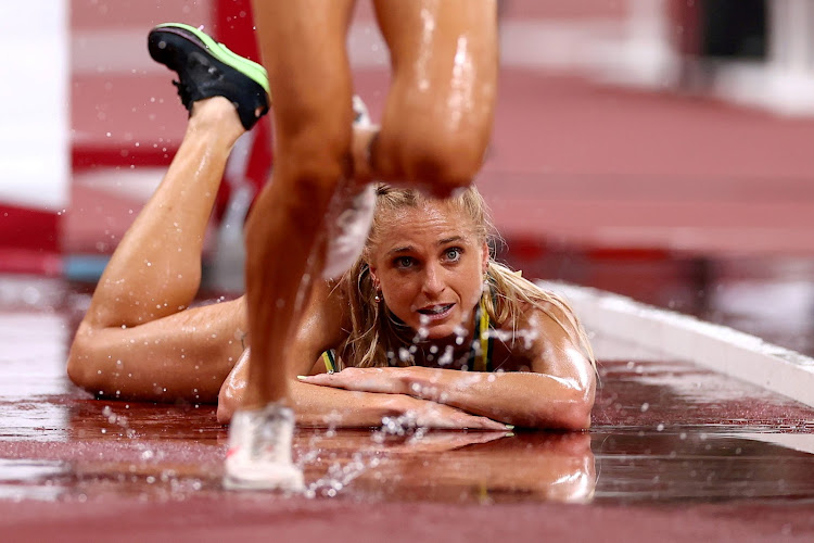 Genevieve Gregson of Australia reacts after falling down during the 3000m steeplechase race during the 2020 Tokyo Olympic Games