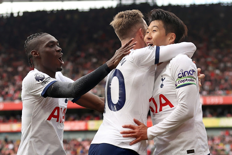 Son Heung-Min celebrates with James Maddison of Tottenham Hotspur after scoring their second goal in the Premier League match against Arsenal at Emirates Stadium on Sunday.