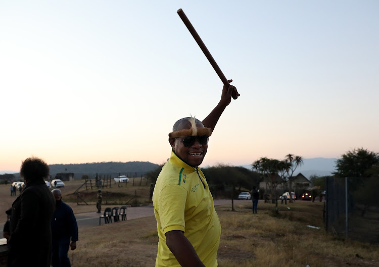 Edward Zuma pictured outside the family's Nkandla homestead on Wednesday evening. He told reporters: 'Give my father's cell to another prisoner because we will not allow his arrest'.