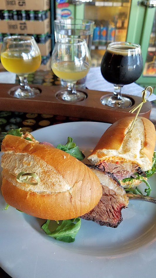 Example Food at Saraveza Smoked Brisket Sandwich with pimento cheese, red onion pickle, and arugula