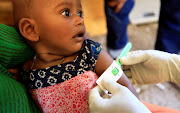 An Ethiopian child who fled war in Tigray region, is screened for malnutrition at the Fashaga camp on the Sudan-Ethiopia border in Al-Qadarif state, Sudan November 20, 2020. 