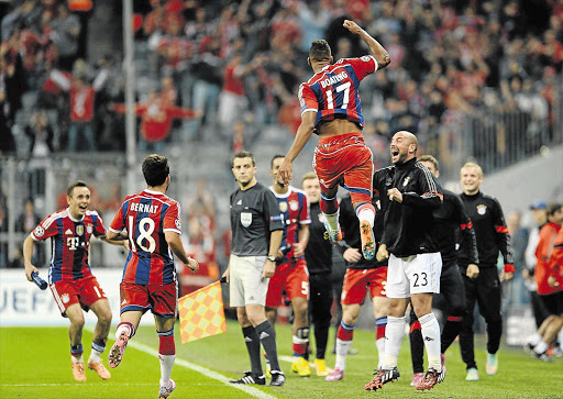 BUOYED: Jerome Boateng of Bayern Munich celebrates after scoring the winning goal against Manchester City during the sides' Uefa Champions League match in Munich, last night