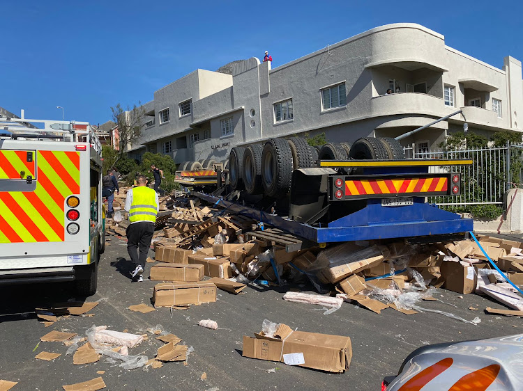 Boxes of frozen fish mince were strewn across a road when a truck overturned on Kloof Street in the Cape Town CBD.