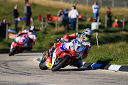 John McGuinness leads local Isle of Man rider Conor Cummins over the mountain during an evening practice at The Isle of Man TT Races on June 02, 2016 on Douglas, Isle of Man.