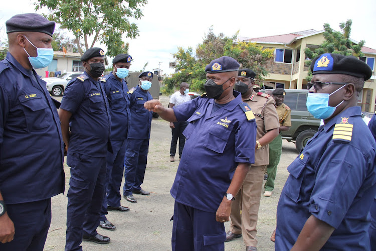 Director General Loonena Naisho with Coast Guard officers during the opening of station in Mbita point, Suba North constituency on December 3,2021