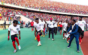 Mozambique players celebrate victory and qualification after their 2023 Africa Cup of Nations qualifier against Benin at Estadio do Zampeto in Maputo, Mozambique on Saturday.