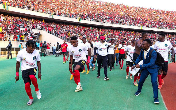 Mozambique players celebrate victory and qualification after their 2023 Africa Cup of Nations qualifier against Benin at Estadio do Zampeto in Maputo, Mozambique on Saturday.