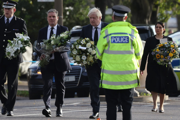 (L-R) Keir Starmer, leader of the Labour Party, Boris Johnson, Prime Minister, and Priti Patel, Home Secretary, arrive to lay flowers at Belfairs Methodist Church on October 16, 2021 in Leigh-on-Sea, United Kingdom. Counter-terrorism officers are investigating the murder of Sir David Amess, the Conservative MP for Southend West, who was stabbed to death.