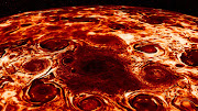 This composite image, derived from data collected by the Jovian Infrared Auroral Mapper (JIRAM) instrument aboard NASA’s Juno mission to Jupiter, shows the central cyclone at the planet’s north pole and the eight cyclones that encircle it.