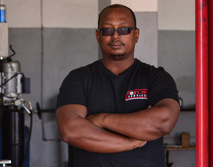 ON THE RIGHT TRACK: Xolisa Tom, owner of Tom's Tyres, has a passion for cars and people