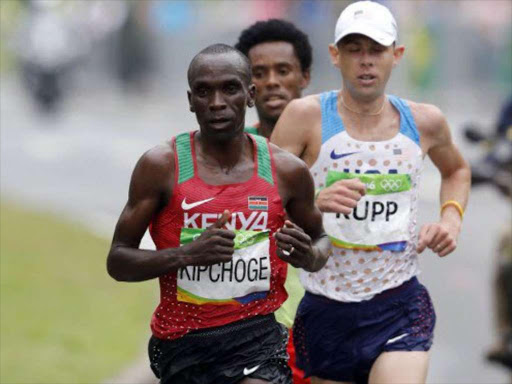 Kenya's Eliud Kipchoge battles closely with USA's Galen Rupp and Ethiopia's Lilesa Feyisa in the men's full marathon in Rio