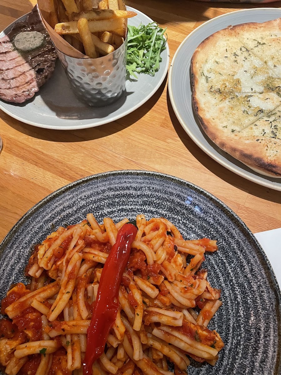 gf  arrabbiata pasta with chicken , gf rosemary garlic bread and minute steak a d chips