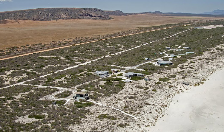 Cape Town businessman Parkin Emslie’s rebuilt beach house (the complex in the centre of the photograph) is only about 35m from the high-water mark.