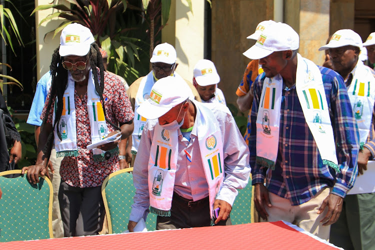 DP Kilifi county organizing secretary Isaac Njuguna, founding member Joseph Katana and Kwale chair Hubert Kutsongwa at Jambo Paradise Hotel in Tononoka on Wednesday.