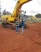 Sergio Guimaraes  stands by the excavator he intended to lease to Junior Marogoa. /Supplied