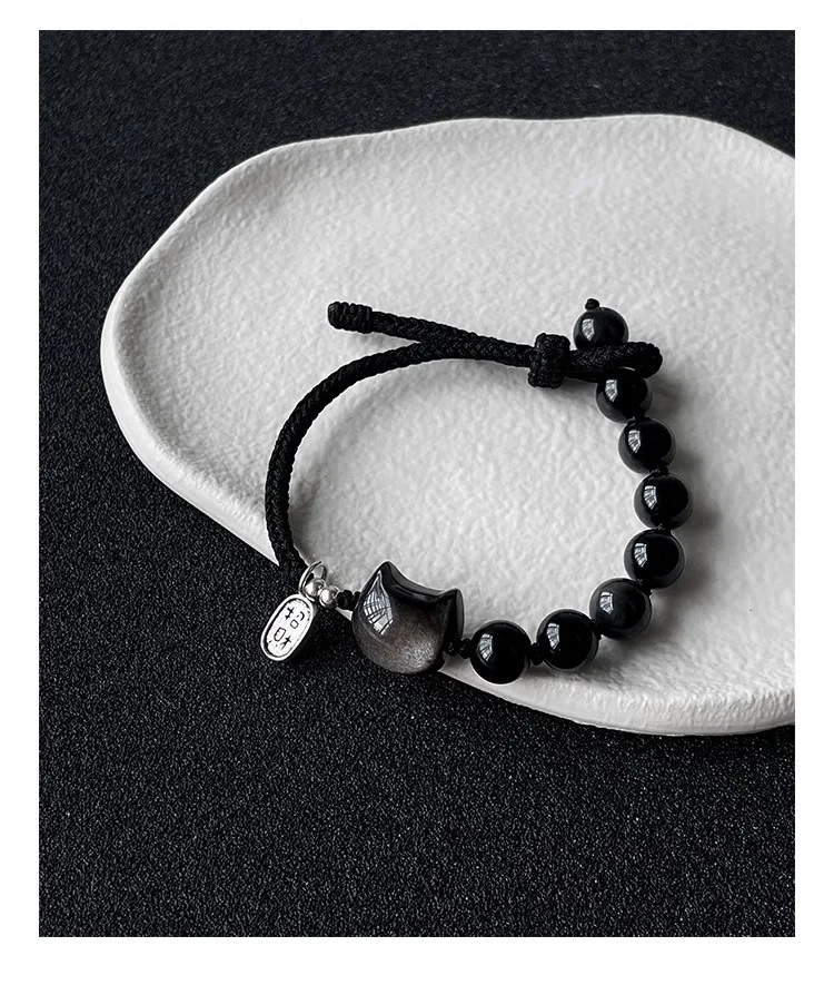 Pulsera de obsidiana natural Xingshi con cuerda trenzada para gatos estilo pareja exquisita ideal para bienestar y protección.