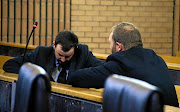 Phillip Schutte and Pieter Dooreward appear in  the North West High Court facing a murder charge. 