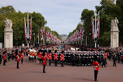 The queen's funeral cortege borne on the gun carriage of the Royal Navy travels along The Mall on September 19, 2022 in London.