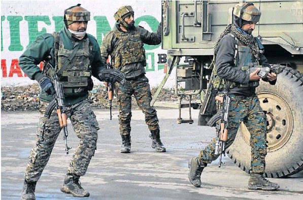 Indian soldiers at the site of a gun battle between suspected militants and Indian security forces in Pinglan village in south Kashmir’s Pulwama district on Monday