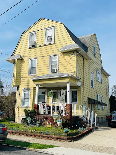 Prestige property for sale in Elmwood Park (United States) - Two-story yellow house with porch
