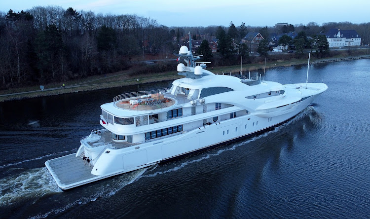 The yacht 'Graceful' sails along the Kiel Canal (Nord Ostsee Kanal) near Rendsburg, north of Hamburg, Germany.