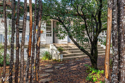 Buy this luxury property in Lège-Cap-Ferret (33970) - Neighborhood Centre Cap Ferret - White house with stairs and garden