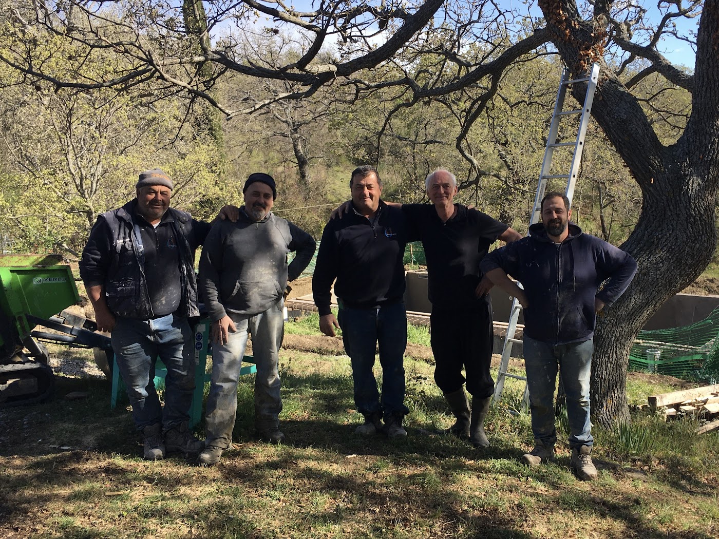 Posing with the Italian construction workers on the site of our swimming pool'