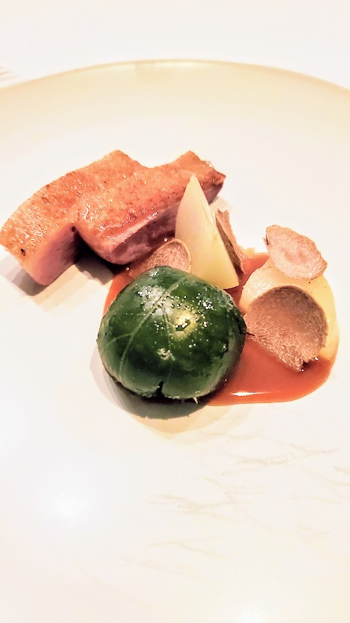 Chef's Menu Experience at Castagna: Duck, kohlrabi, sesame leaf. Inside the sesame leaf there is a boudin blanc sausage - and also there are a few shavings of truffles on the dish