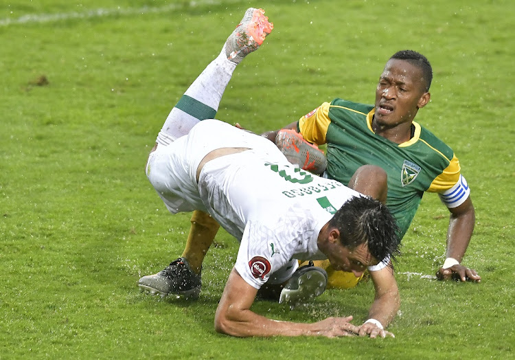 Lamontville Golden Arrows' Matome Mathiane challenges Mamelodi Sundowns' Mauricio Affonso in Arrows' 3-2 Absa Premiership victory at Sugar Ray Xulu Stadium in Durban on Sunday.