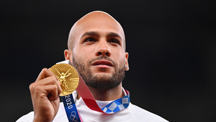 Gold medallist, Lamont Marcell Jacobs of Italy poses on the podium. Picture: REUTERS/DYLAN MARTINEZ