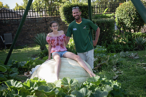 Peet Joubert and daughter Megan pose with Howie the squash which won first place at the Goliat van Gat Pumpkin Festival in Centurion on Saturday.